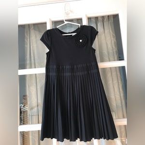 Gymboree size 7 black dress pleated skirt with black flower detail & “gem”